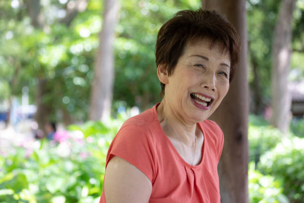 istock Japanese senior woman enjoying hydrangea garden 977364348