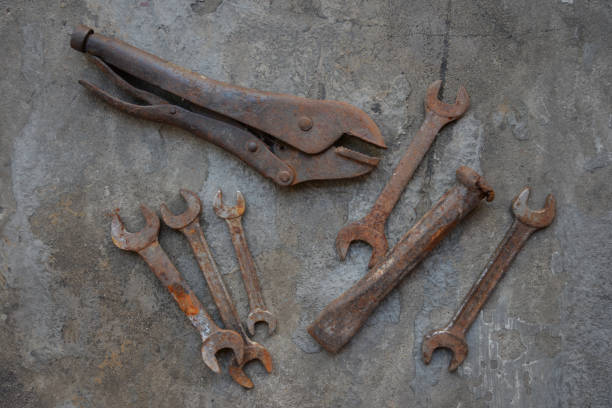istock Old Mechanic Tool such as wrenches, chisels and lock pliers on the concrete floor 977373052