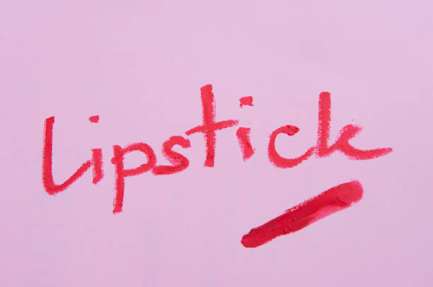 istock Red lipstick wording from lipstick on the pink background 977373106