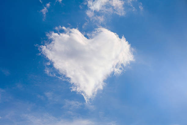 A cloud in the sky in the shape of a heart stock photo