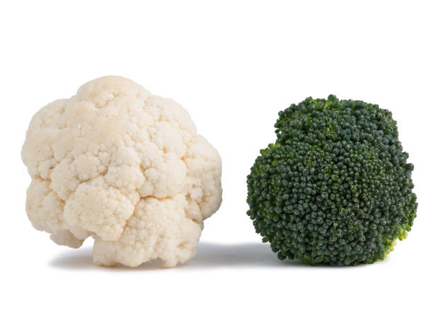 istock Fresh Broccoli and Cauliflower isolated on white 977393560