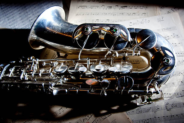 Saxophone and old Sheet music stock photo