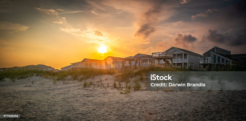Sunlight Through the Dunes A brilliant sky hovers over beach homes nestled into the dunes. The Hamptons Stock Photo