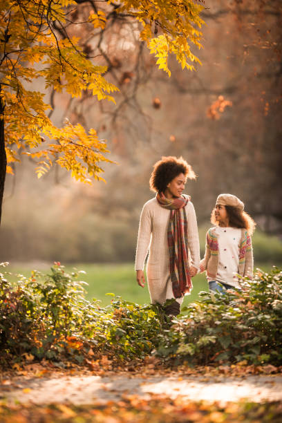 istock Mother-daughter autumn walk at the park! 977405298