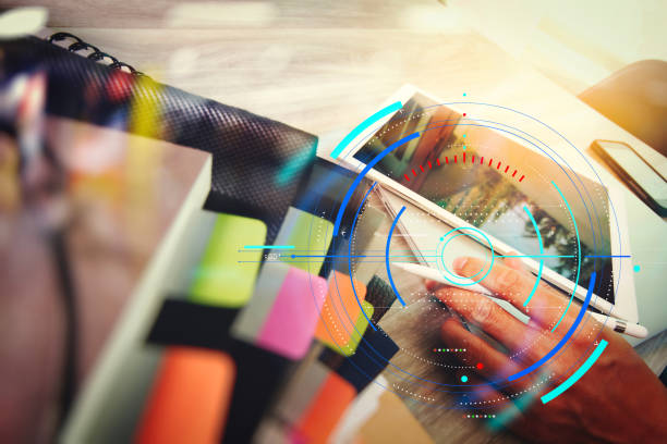 istock business documents on office table with smart phone and digital tablet and graph business with social network diagram and man working in the background 977406120