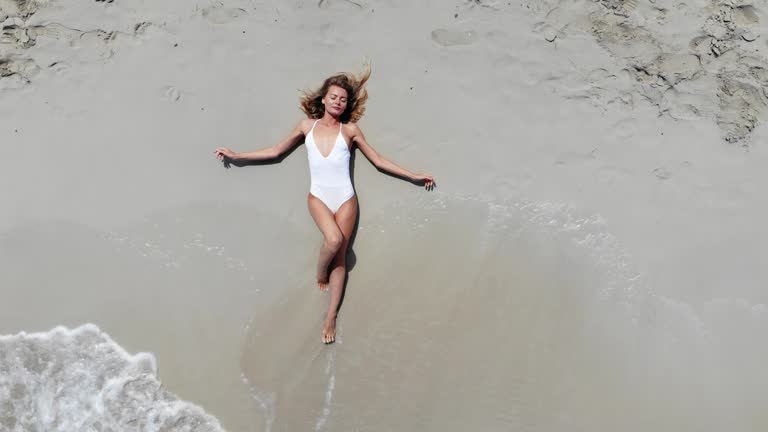 Beautiful Young Woman at the Beach, Drone View