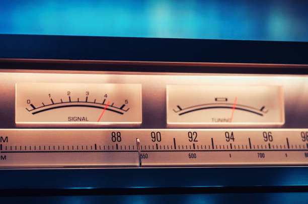 istock Vintage amplifier tuner scale with VU meters close up shot 977431532