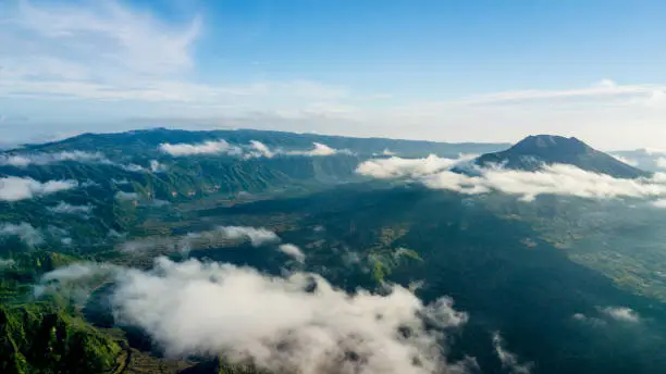 Beautiful landscape of Batur mountain with mist under blue sky in the Bali, Indonesia
