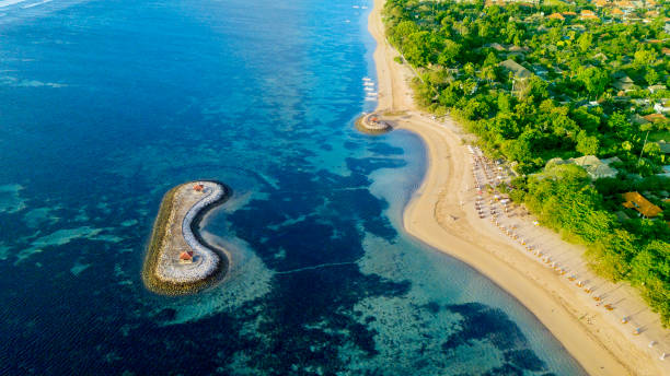 istock Beautiful Sanur beach with turquoise water 977439718