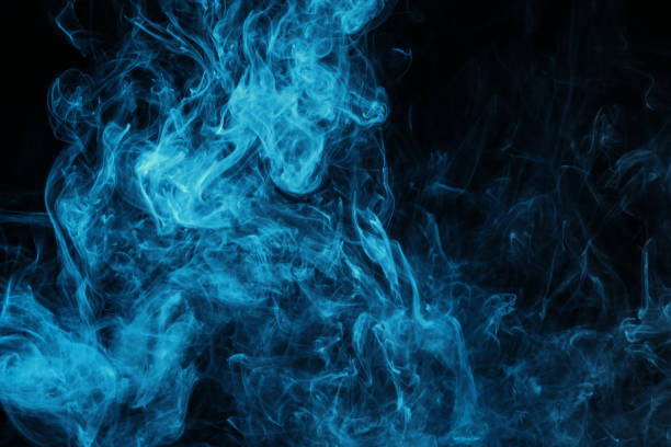istock blue mystical smoke on black background 977442626