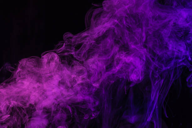 istock mystical purple smoke on black background 977442706