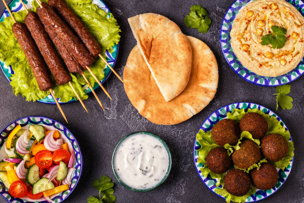 istock Classic kebabs, falafel and hummus on the plates. 977443066