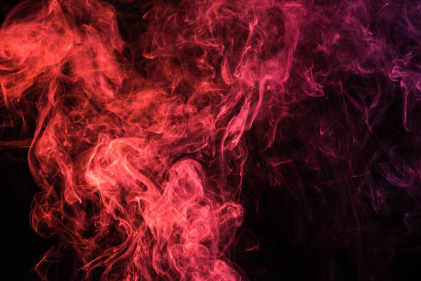 istock red mystical smoky swirl on black background 977443222