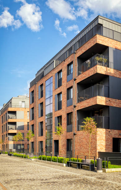 istock New complex of apartment buildings with a brick facade 977447344