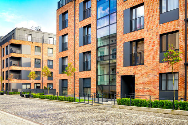 istock New complex of apartment buildings with a brick facade 977447362