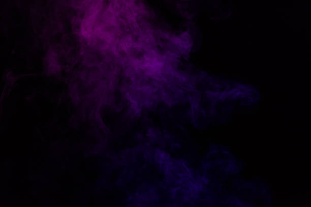 istock spiritual black background with purple smoke 977447428
