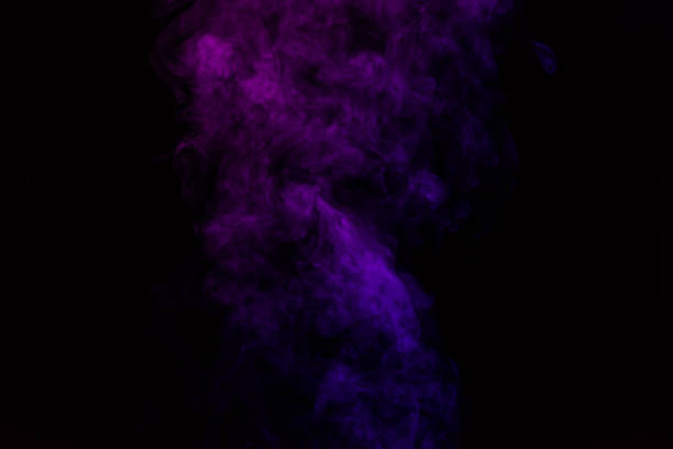 istock mystical abstract black background with purple smoke 977447742