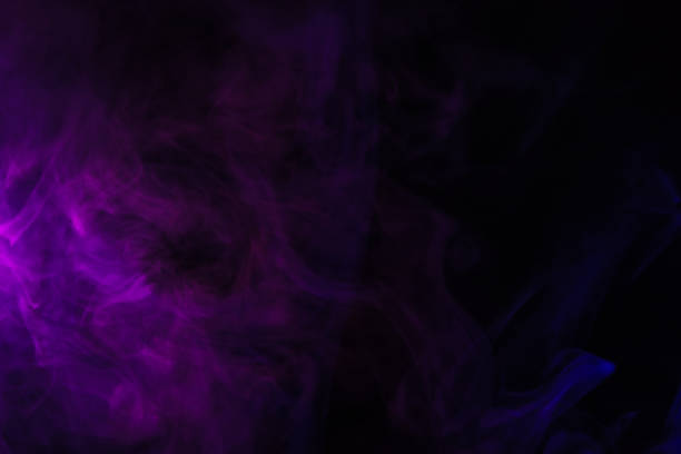 istock abstract black background with purple smoke, studio shot 977447862