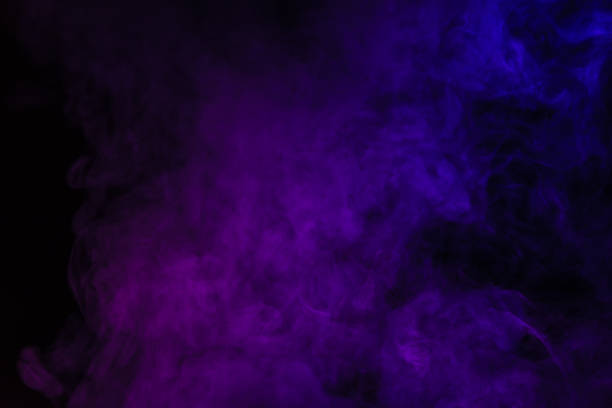 istock abstract black background with purple smoke 977450428