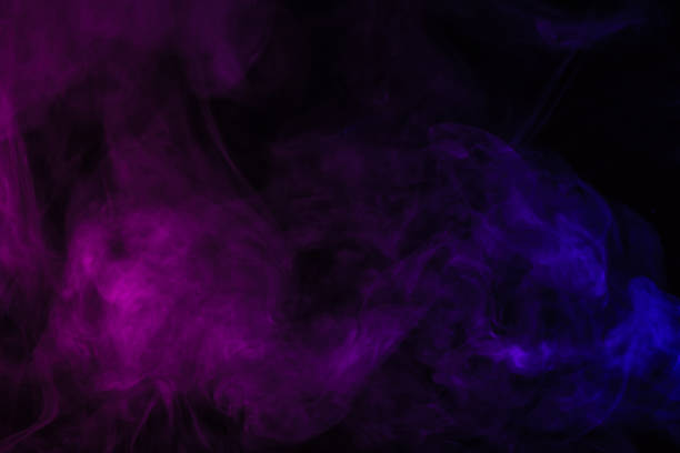 istock abstract black background with violet and purple smoke 977450490