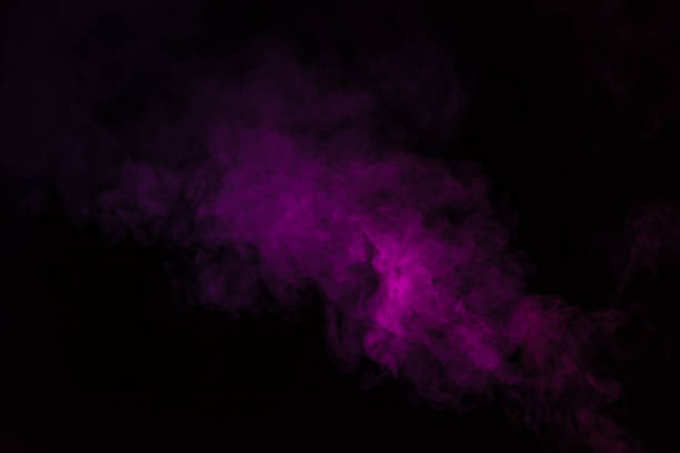 istock abstract black background with pink steam 977451180