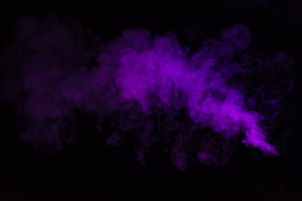 istock black background with purple smoky swirl 977451220