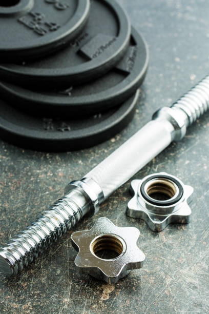 istock The metal dumbbell on old table. 977467754