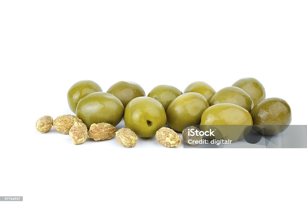 Green olives and some pits  Olive - Fruit Stock Photo
