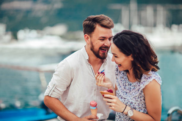 istock Happy couple having date and eating ice cream on vacation. 977476348