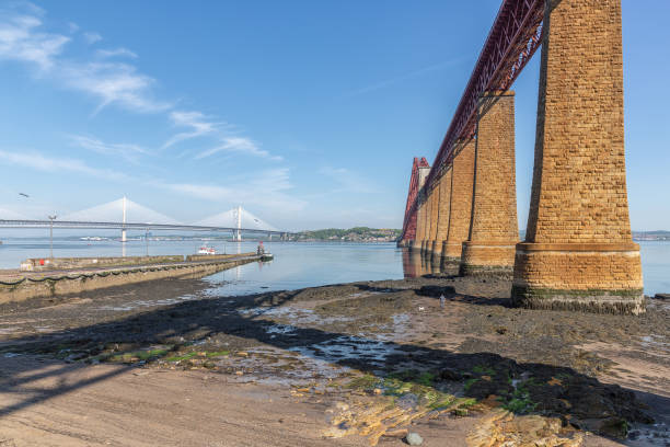 istock Forth Bridge Scotland and landing-stage for launches. 977479732
