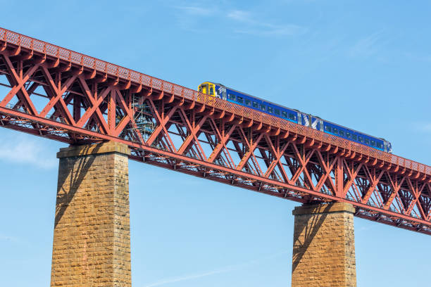 istock Forth Bridge, railway bridge in Scotland with train passing 977479756