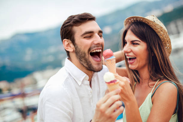 istock Happy couple having date and eating ice cream on vacation. 977479928