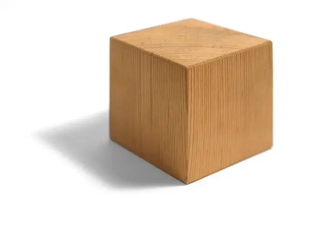 studio photography of a light brown wooden cube isolated on white with shadow