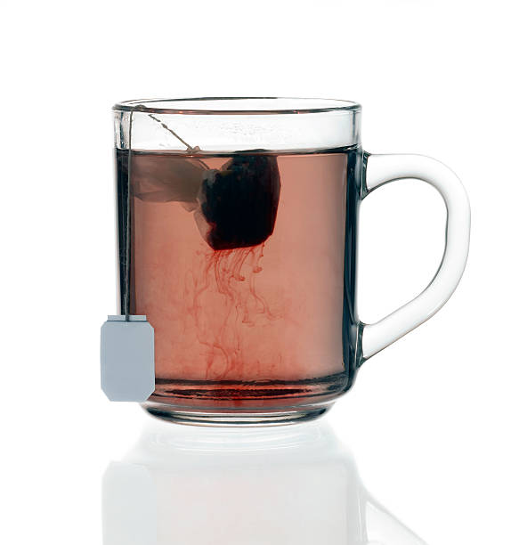 istock glass teacup with tea bag 97748161