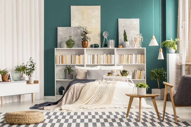 istock Checkered rug in stylish bedroom 977483458