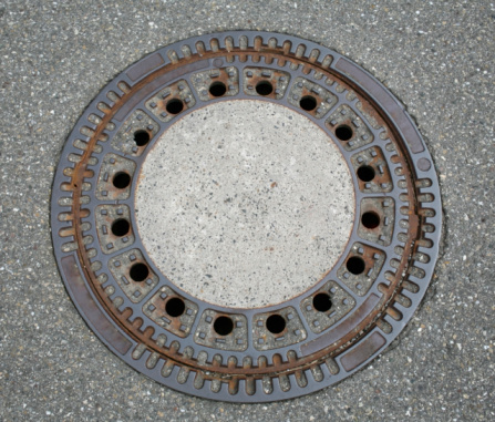 round manhole cover seen from above