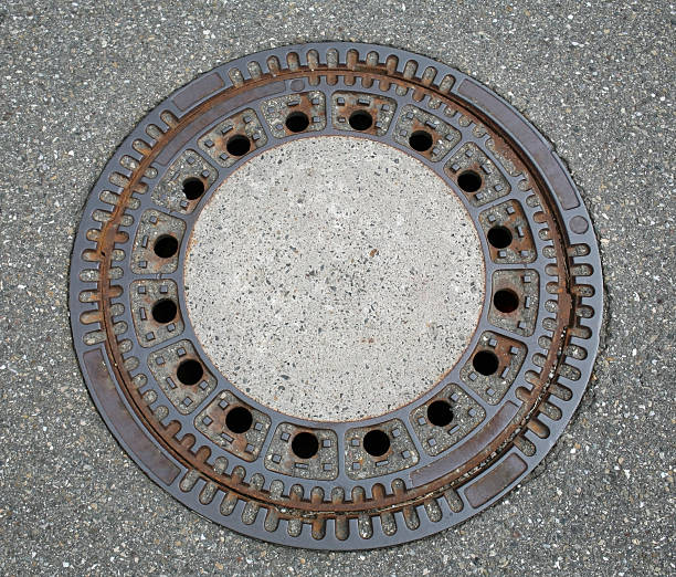 round manhole cover round manhole cover seen from above sewer lid stock pictures, royalty-free photos & images