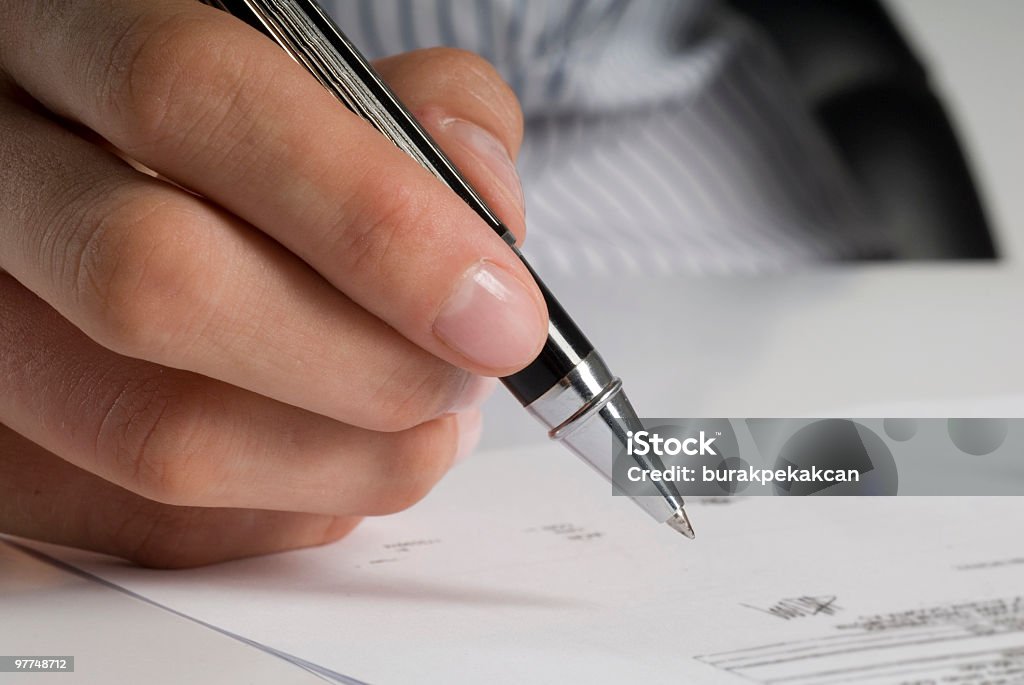 Businesswoman signing documents, Close-up of hands  Assertiveness Stock Photo