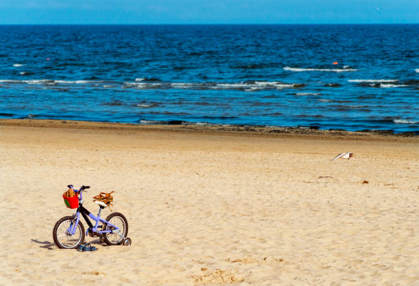 istock Bicycle at sandy beach of Jurmala 977497210