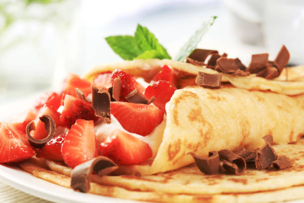 istock Strawberries and cream crepes garnished with chocolate 97749842
