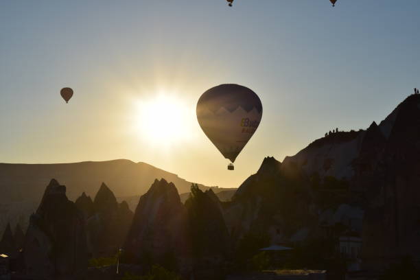 istock Sunrise lanscape with hot air balloons 977503886