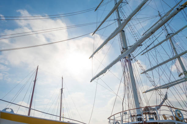 Rigging of a tall ship in a port in sunlight in spring