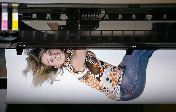 printing a girl looks like falling out of a large format printer