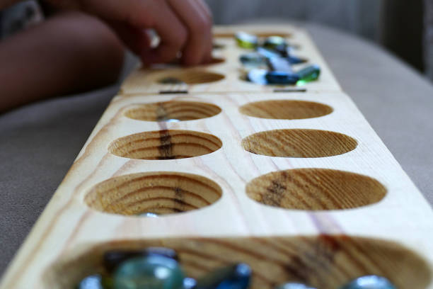 istock wooden mancala and stones, 977522272