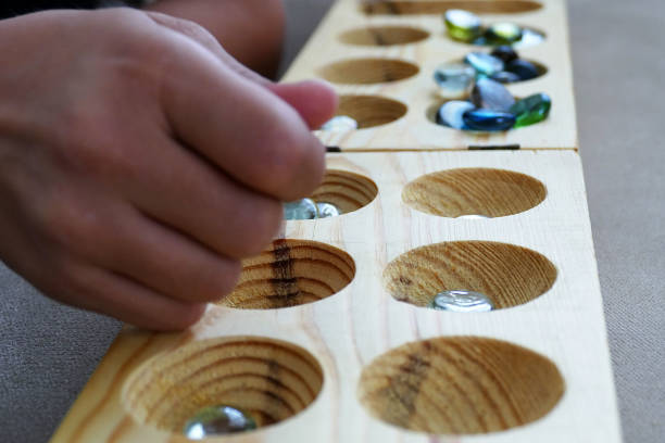 istock wooden mancala and stones, 977522422