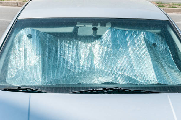 istock Sun reflector on the windscreen or windshield as protection of the car plastic indoor panel from direct sunlight and heat 977526274