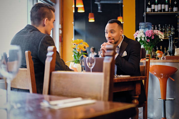 istock Men having a business meeting in a restaurant. 977527652