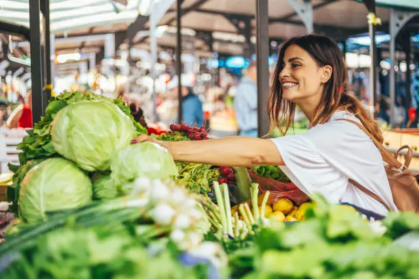 Photo of Smiling girl decided to cook a delicious and healthy meal