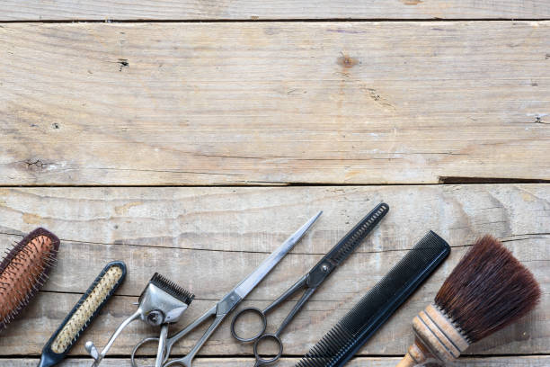 istock Old vintage barbershop tools on wooden table 977553104