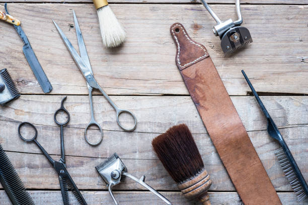 istock Old vintage barbershop tools on wooden table 977554510